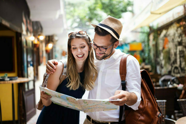 a man and woman looking at a map