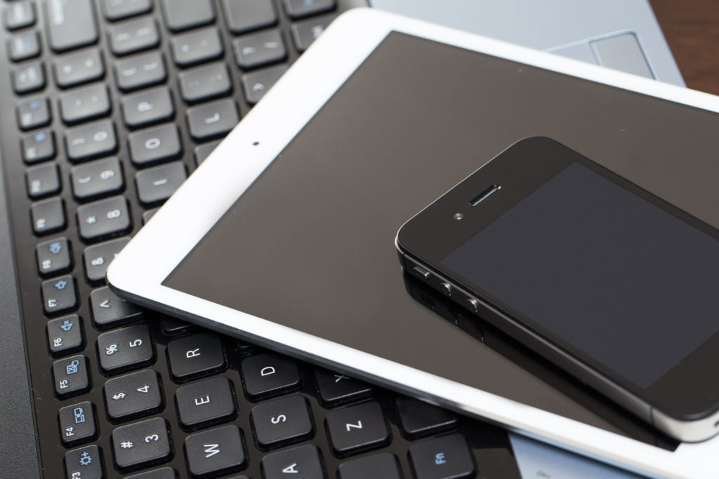 a cell phone on a keyboard
