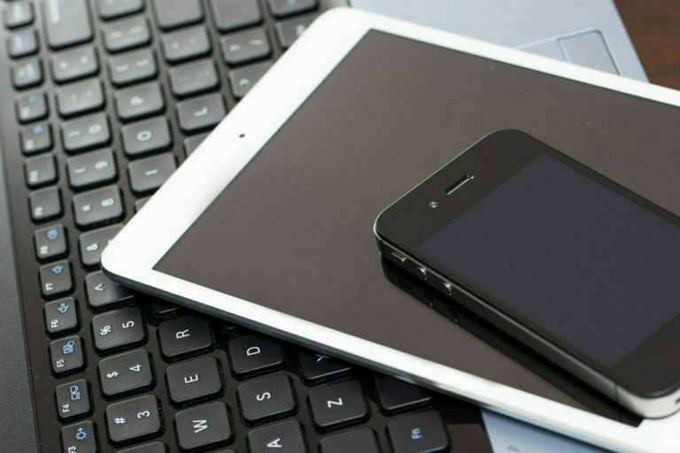 a cell phone on a keyboard