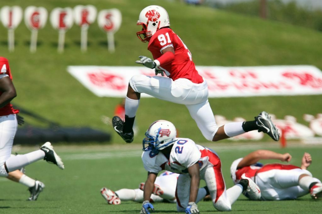 a football player running with the ball
