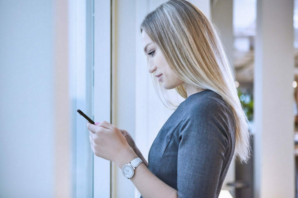 a woman looking at a phone