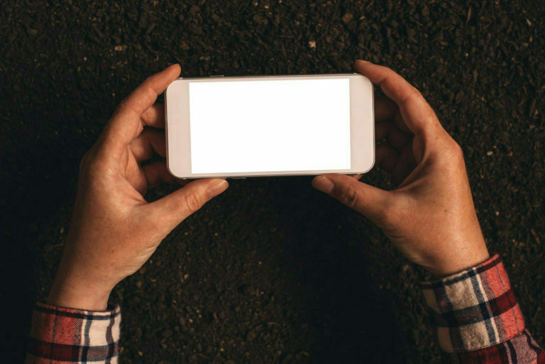 a person holding a white rectangular object