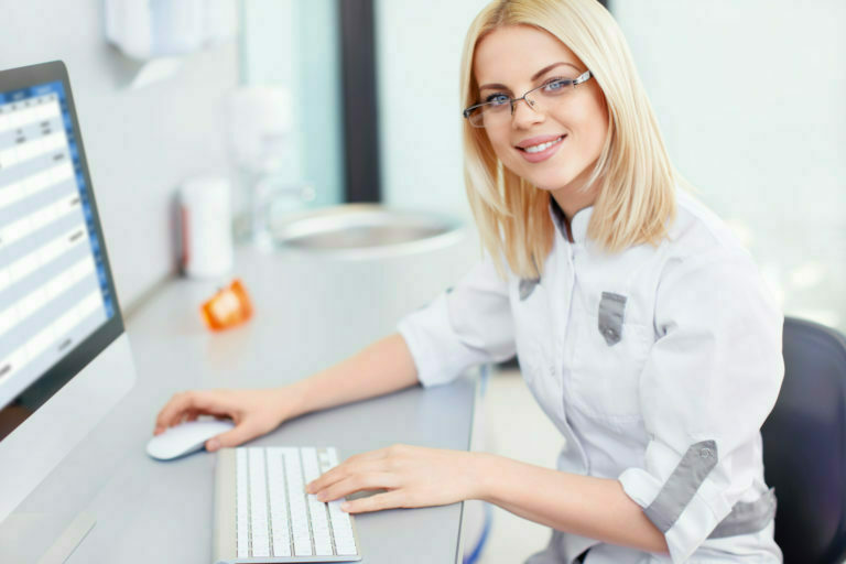 a woman in a white coat