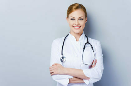 a doctor smiling with her arms crossed